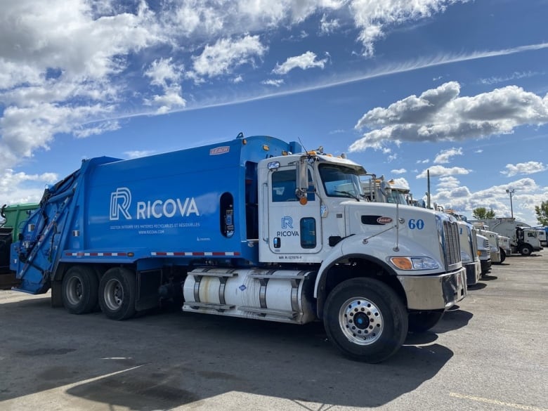 A blue Ricova waste removal truck