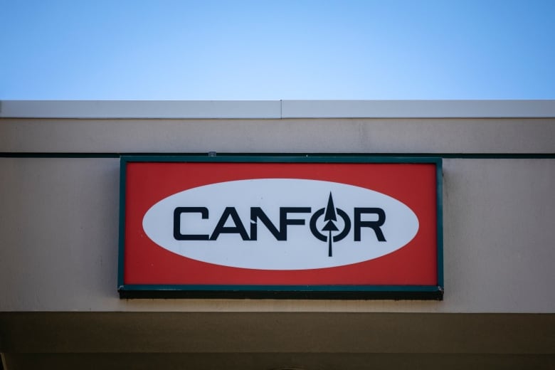 A business with a sign reading 'CANFOR'.