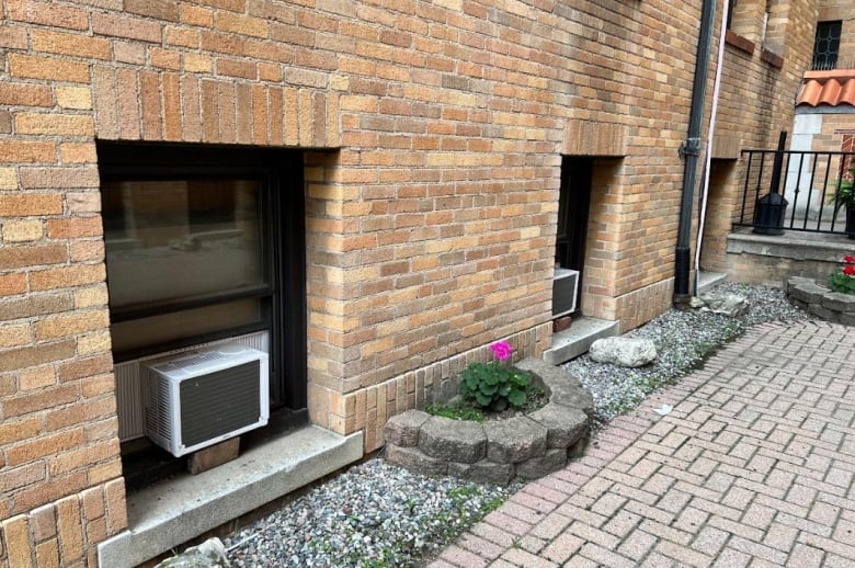 The basement windows in this apartment complex are on ground-level, not posing the same risk as someone on a higher level with a window AC unit.