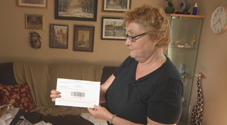Anca Nitu holds up one return slip that came with a package delivered to her home. 
