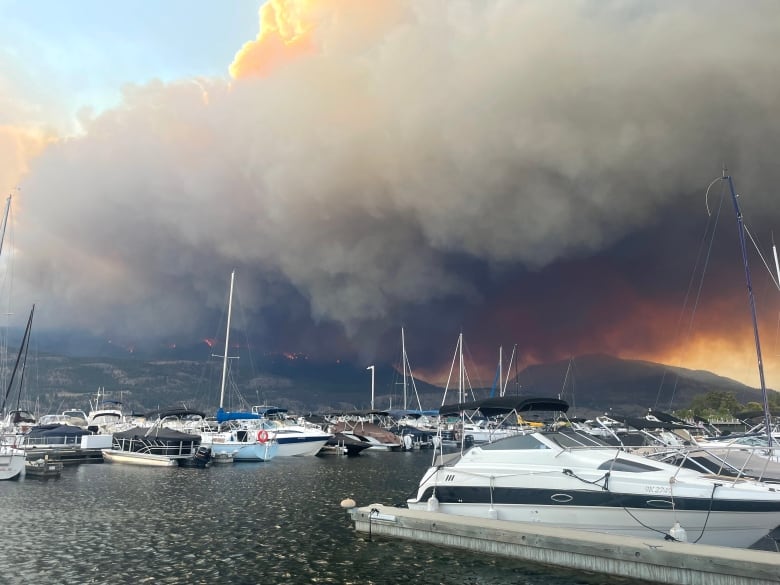 thick smoke over Okanagan Lake and several boats