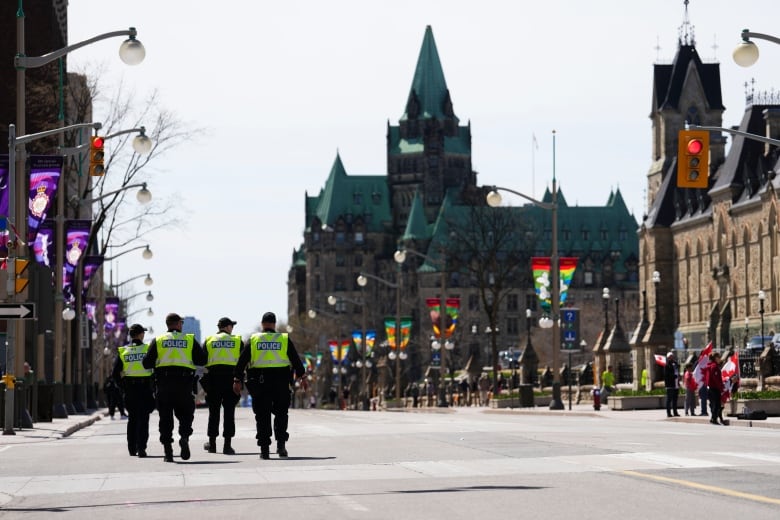 Police officers patrol Wellington Street in downtown Ottawa May 1, 2022, the day the Rolling Thunder rally was scheduled to end.