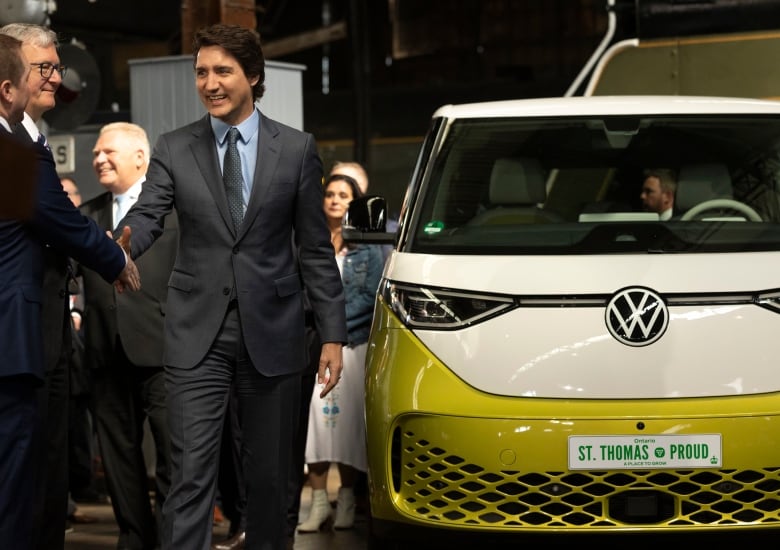 Prime Minister Justin Trudeau shaking hands with officials from Volkswagen.