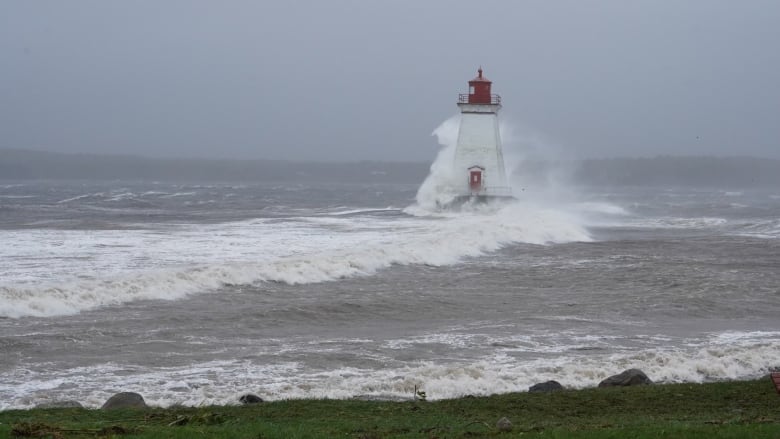 The Sandy Cove lighthouse in the waves whipped up by post-tropical storm Lee.
