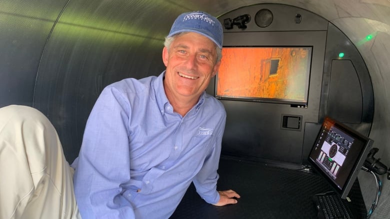 OceanGate founder and CEO Stockton Rush reclines inside the submersible Titan, a sub used to explore the wreck of The RMS Titanic.