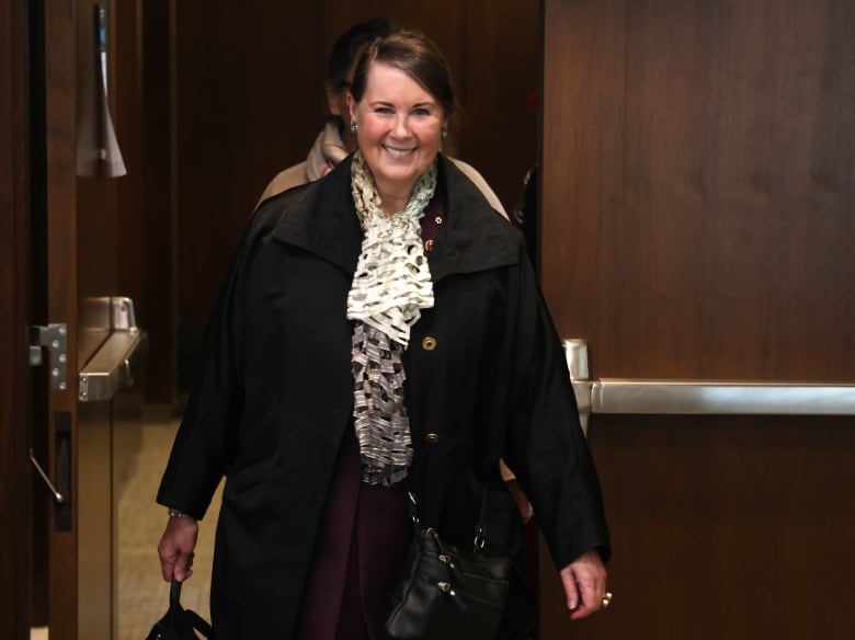 Sen. Marilou McPhedran is seen walking into a House of Commons committee meeting.