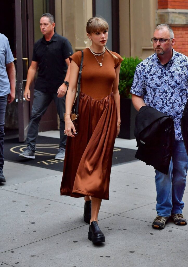 taylor swift pictured in a chic brown dress at zero bond restaurant in new york