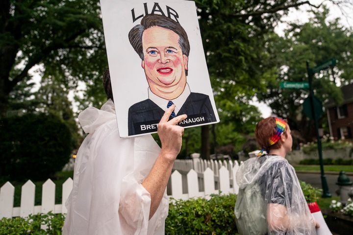 Protesters march past Supreme Court Justice Brett Kavanaugh's home on June 8, 2022 in Chevy Chase, Maryland after the court's decision overturning Roe v. Wade leaked.