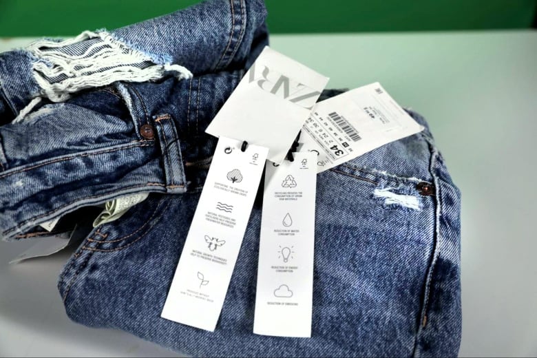 Hang tags on a pair of jeans. 