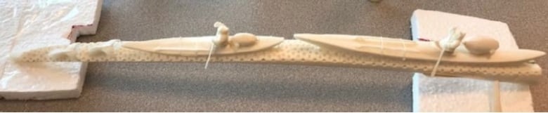 a carved walrus tusk