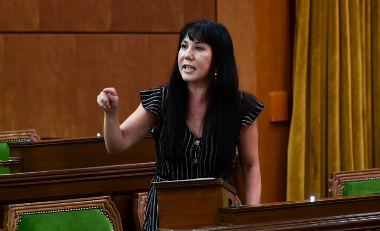 A politician points while giving a speech.