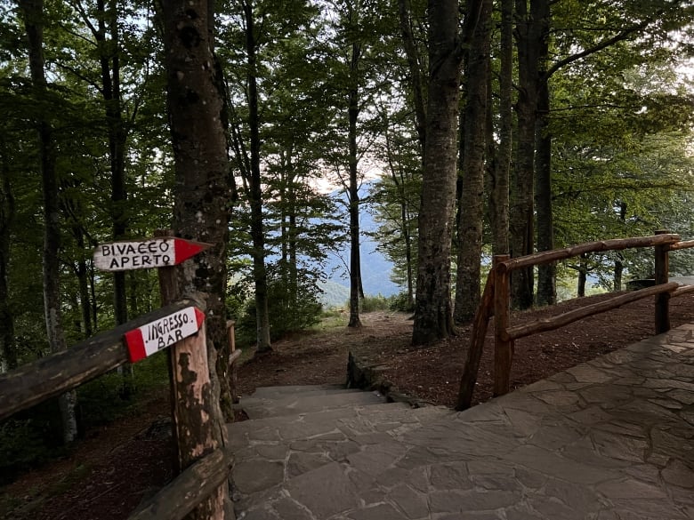 Red and white wooden signs mark the 'Sentiero Italia' or 'Great Italian Trail'