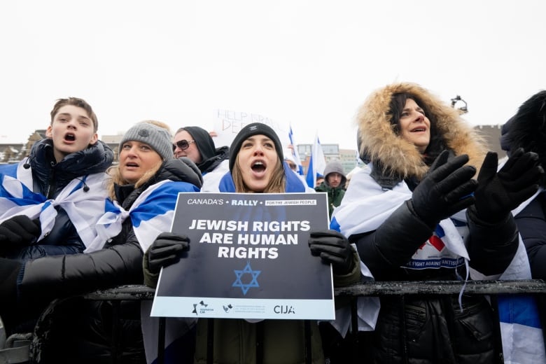 Pro-Israel protestors chant during a pro-Israel protest on Parliament Hill in Ottawa, on Monday, Dec. 4, 2023. 