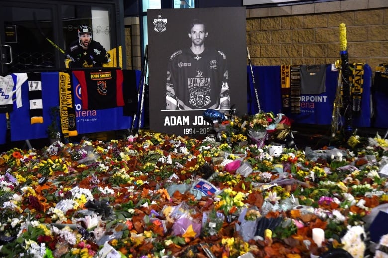 Flower tributes for Nottingham Panthers Adam Johnson outside the Motorpoint Arena before a game between Nottingham Panthers and Manchester Storm in Nottingham, England, on Nov. 18, 2023. Johnson, 29, suffered a fatal cut to his neck during a game against Sheffield Steelers on Oct. 28, 2023. 
