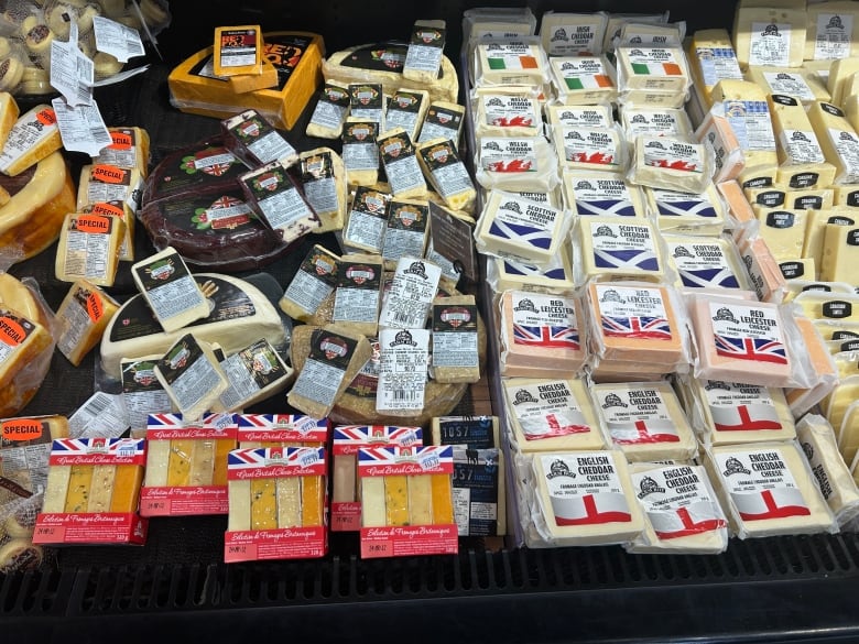 A display of packaged cheese for sale at a store.
