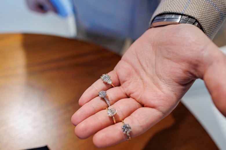 Diamond expert Michael Nehme holds rings featuring lab-grown diamonds at the Vrai Yorkville, Toronto, showroom on Dec. 8, 2023.