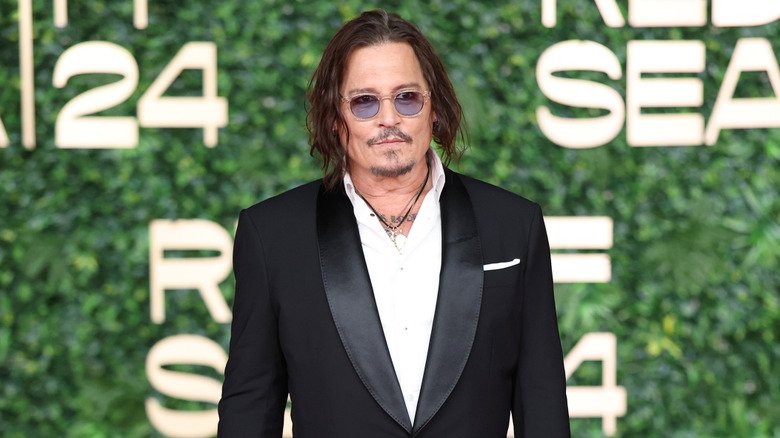 Much like his character, he's not afraid of speaking his mind, Celebs Who Brian Cox Absolutely Can't Stand 4 Johnny Depp wearing tinted glasses