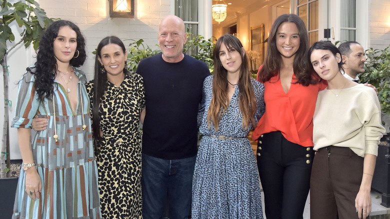 The Transformation of Demi Moore from Teenager to 62 Years Old 8 Demi Moore with ex husband Bruce Willis and their children, and Emma Heming