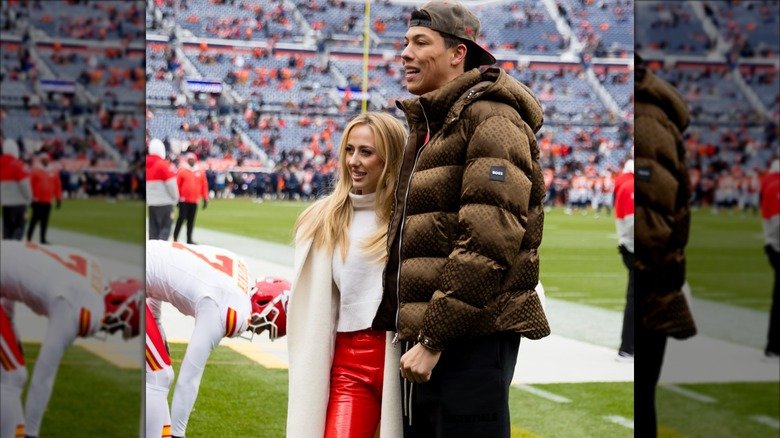 Jackson and Brittany Mahomes posing for photos