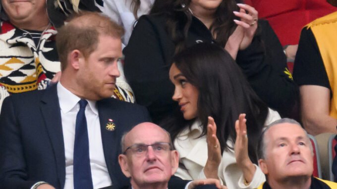 Meghan's Lovey Display With Harry Can't Distract From His Karmic Baldness