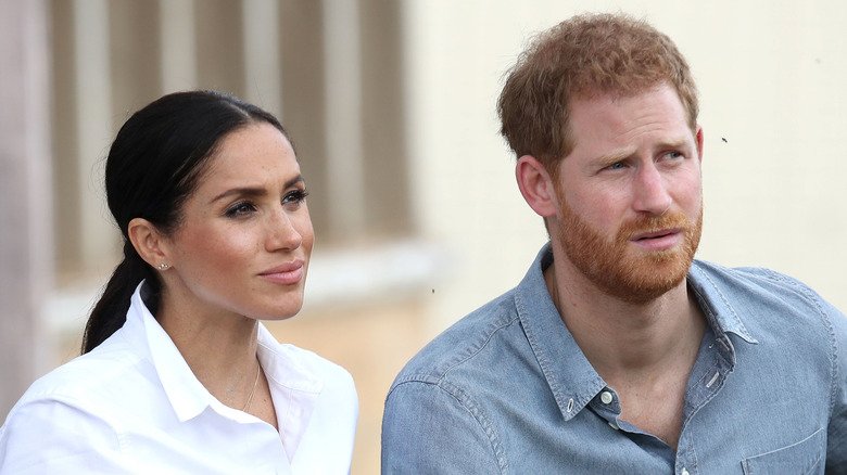 What You Dont Know, 9 Signs Prince Harry & Meghan Markle Are Headed Towards Divorce 131 Meghan Markle and Prince Harry sitting down.