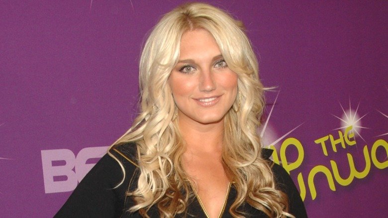 Brooke Hogan tilts her head and smiles at a BET event.