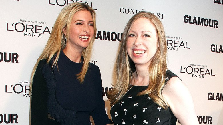 Ivanka Trump and Chelsea Clinton laughing in step-and-repeat