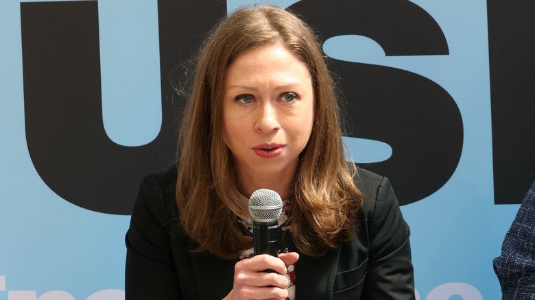Chelsea Clinton speaking into mic