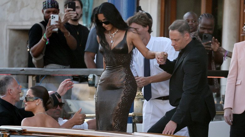 Kim Kardashian wearing a brown dress ahead of Jeff Bezos and Lauren Sánchez's Venice wedding