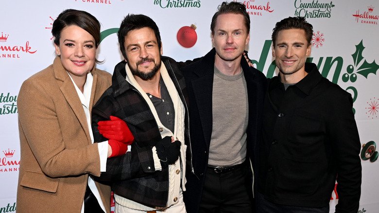 Kimberley Sustad posing with the stars of "Three Wiser Men and a Boy."