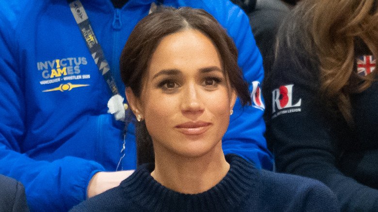 The Photos, The Freckles, and That Uncomfortable Feeling: What People Are Saying About Meghan’s New Look 2 Meghan Markle sitting down while watching a basketball game
