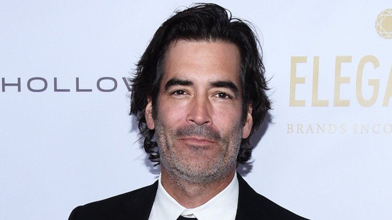 Carter Oosterhouse posing at the 2019 WildAid Gala at the Beverly Wilshire Four Seasons Hotel