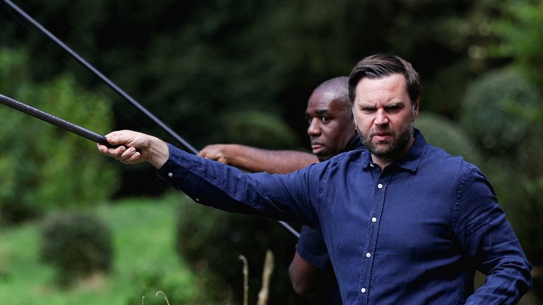 JD Vance scowls while fishing.