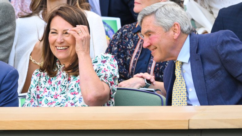 Carole and Michael Middleton laughing together at Wimbledon in 2024.