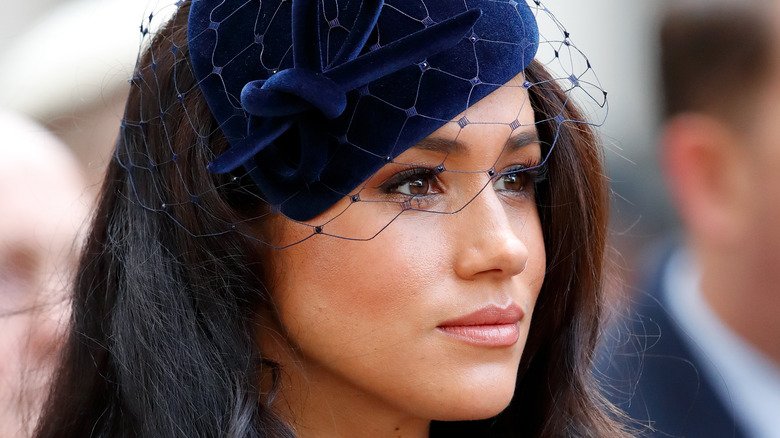 Meghan Markle in a blue hat and veil
