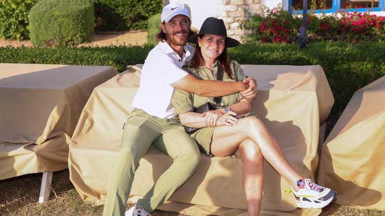 Beyond the Numbers: The Enduring Partnership of Tommy and Clare Fleetwood 7 Tommy Fleetwood hugging Clare Fleetwood