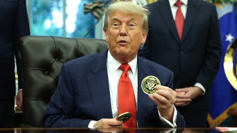 Rumors Trump Couldn't Shake. 134 Donald Trump holding a coin in the Oval Office