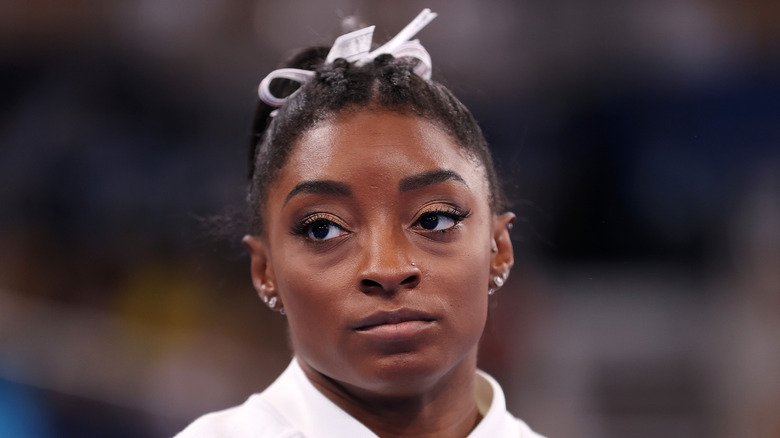Simone Biles and Jonathan Owens: Navigating the Spotlight in a High-Profile Marriage 130 Simone Biles with a serious expression on her face