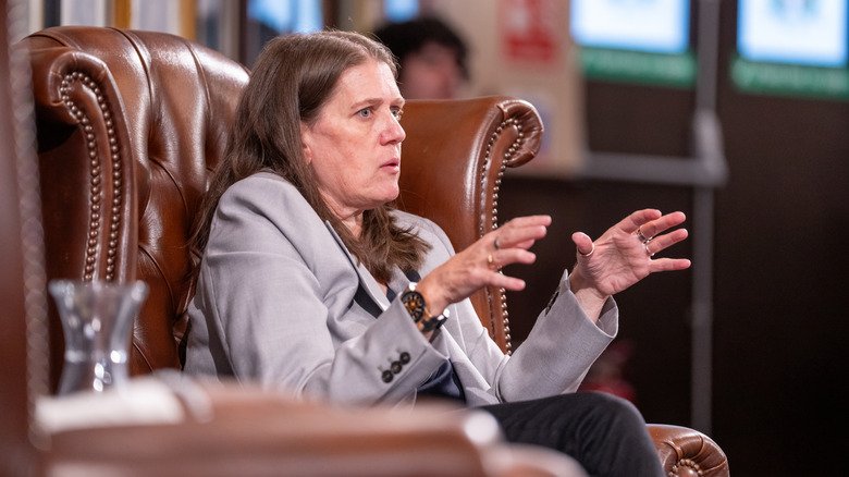 Mary L. Trump in a chair speaking at Cambridge Union