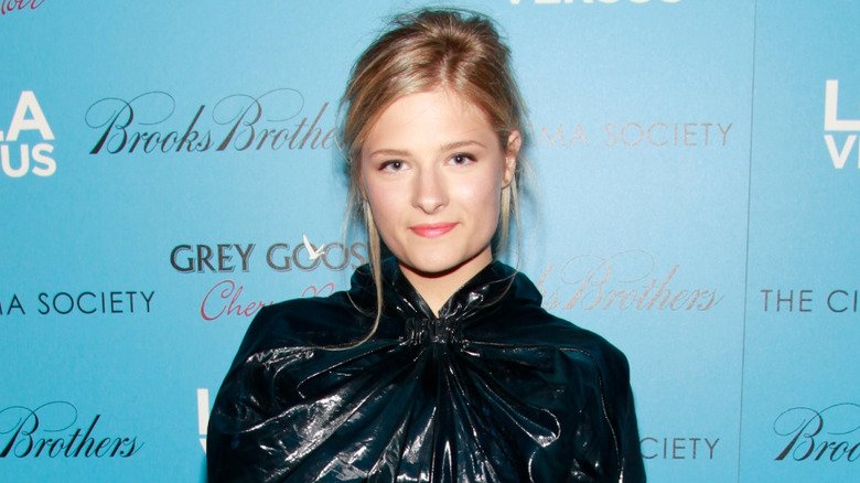 Louisa Jacobson posing in front of a blue background in 2012