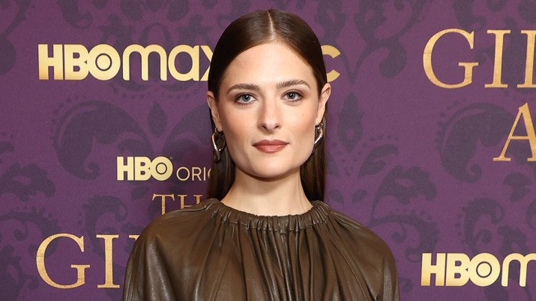 Louisa Jacobson posing in front of a purple HBO Gilded Age background