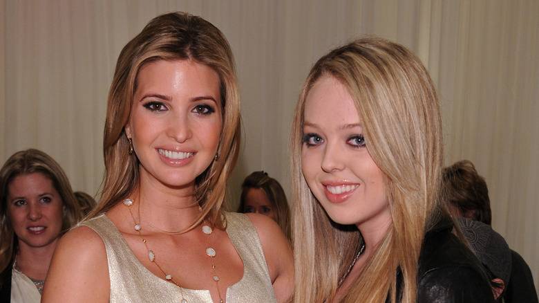 Ivanka Trump posing with Tiffany Trump and smiling