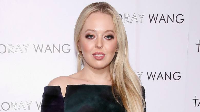 Tiffany Trump posing in front of a white background