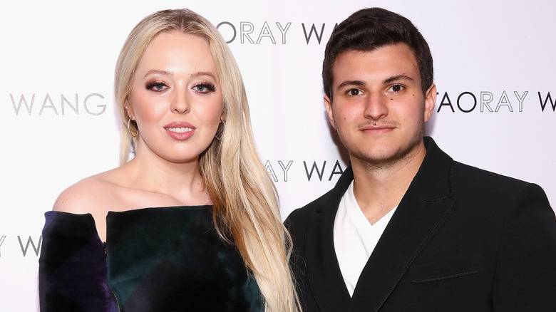 Tiffany Trump posing and smiling with Michael Boulos