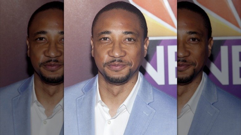 Why These Actors Left Criminal Minds 11 Damon Gupton smiling on red carpet