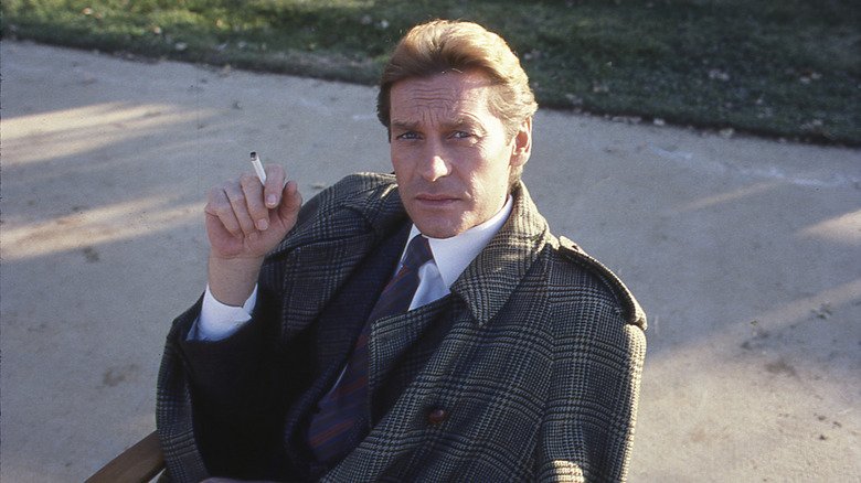 Helmut Berger taking break during filming of Dynasty