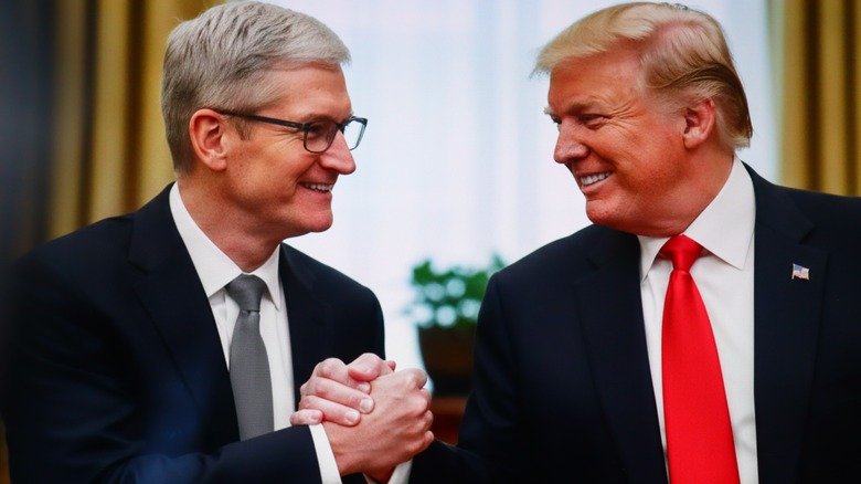 Tim Cook, Apple CEO, and US President Donald Trump shaking hands at a meeting, symbolizing business, leadership, and technology-industry discussions. New York, US - 25 September 2025.
