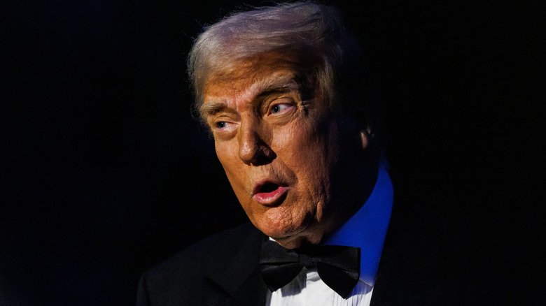 Donald Trump speaking to journalists as he leaves the White House South Lawn.