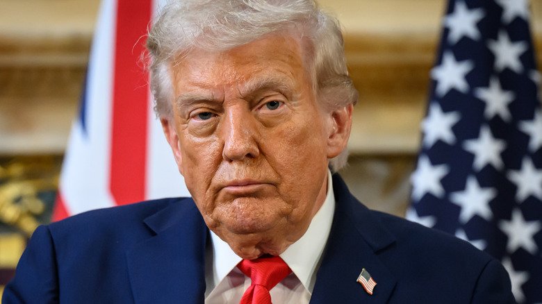 Donald Trump looks straight ahead during a meeting in the UK.