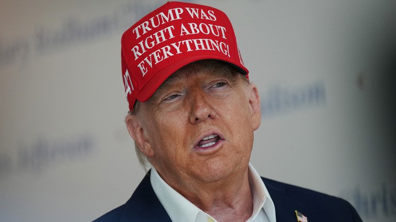 Donald Trump wearing a 'Trump was right about everything' cap.